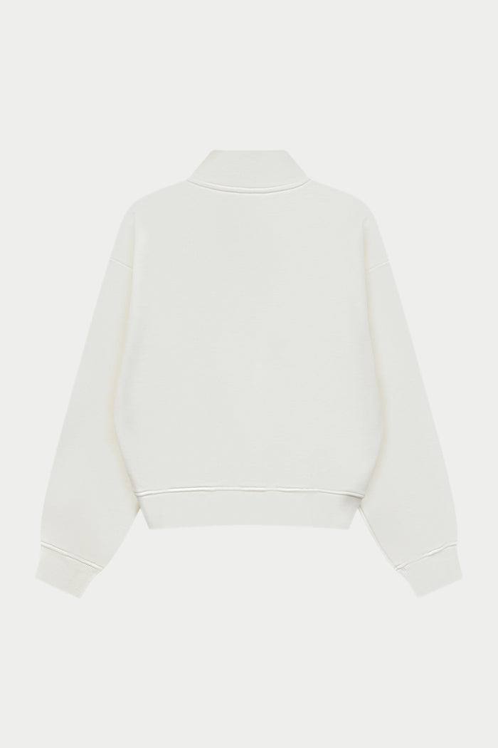 Off white quarter zip sweatshirt on a white background