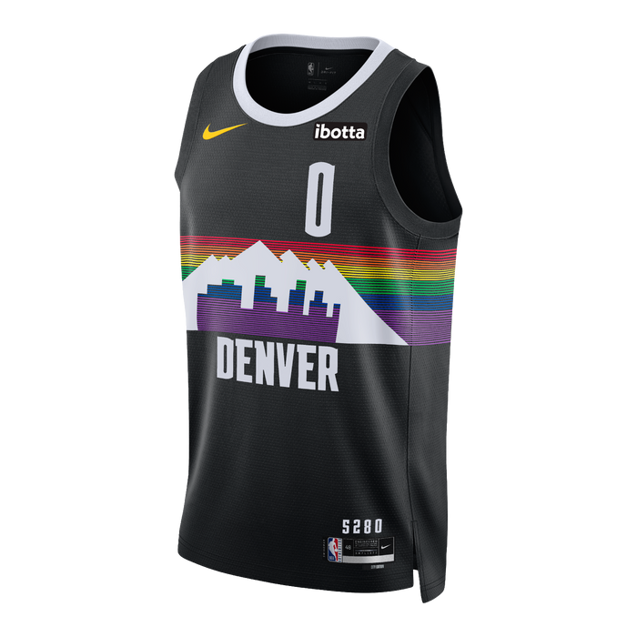 Front view of a black sleeveless basketball jersey shown from a slight angle. The center features a bold, retro-style graphic displaying a white mountain range and a purple city skyline cutout overlaying a horizontal rainbow stripe pattern. The word 'DENVER' is printed directly below the graphic in bold white block text. The jersey includes a white collar line, a yellow Nike swoosh logo on the right chest, an 'Ibotta' sponsor patch on the left chest, the number '0' printed in white on the upper