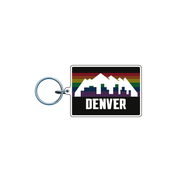 A small, rectangular acrylic keychain attached to a classic silver split metal ring. The charm features the vintage Denver 'tetris' graphic with a white mountain silhouette and city skyline overlaying horizontal rainbow stripes on a solid black background. The word 'DENVER' is printed in bold white block lettering along the lower section