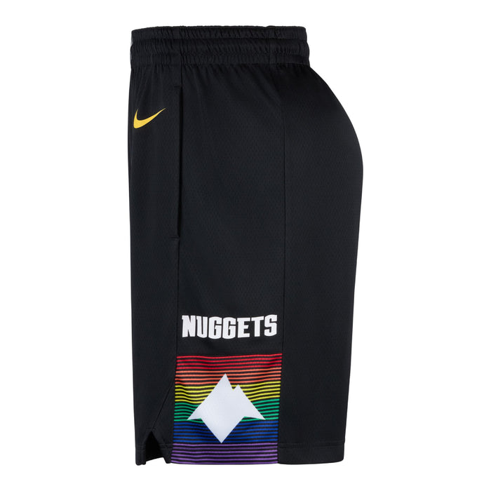 Side profile view of the black basketball shorts highlighting the left outer leg. The lower third of the leg features a square graphic block with the text 'NUGGETS' stacked on top of a vibrant, horizontal multi-colored rainbow stripe pattern. Centered over the rainbow stripes is a crisp white geometric mountain silhouette