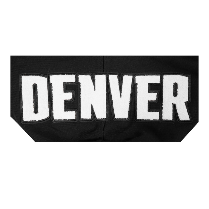 A close up view on outside of hood of the white Denver wordmark logo on black jersey