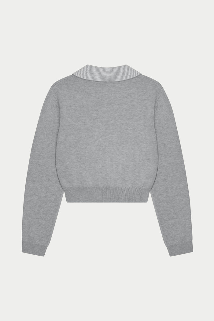 Grey long sleeved polo top with collar on a white background