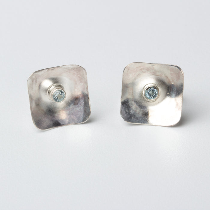 square silver posts with blue topaz