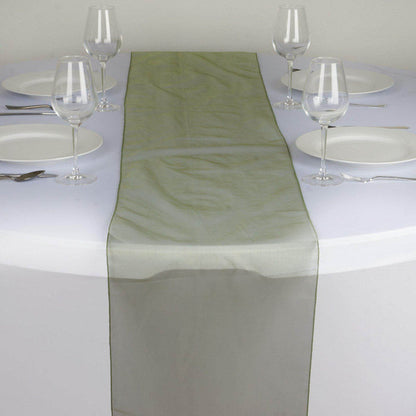 Elegant sheer table runner in soft green on a dining table setting. #whtbkgd