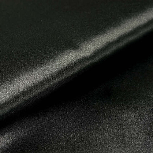 Black satin fabric with a smooth, glossy finish. #whtbkgd
