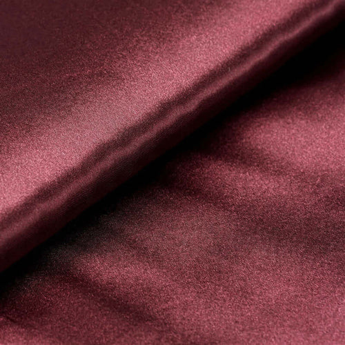 Burgundy satin fabric with a smooth, glossy texture. #whtbkgd