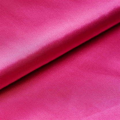 Vibrant fuchsia satin fabric with a smooth finish. #whtbkgd