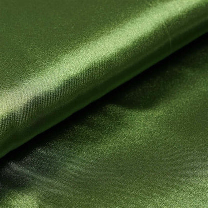 Shiny green fabric folded, showcasing its smooth texture. #whtbkgd