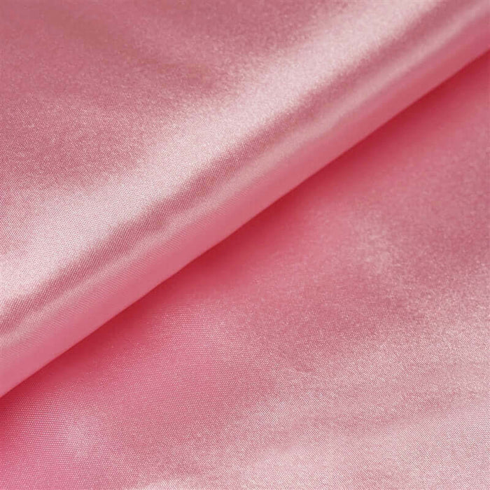Pink satin fabric with a smooth, glossy texture. #whtbkgd