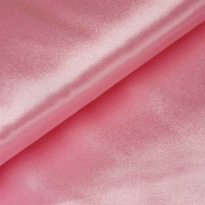Pink satin fabric with a smooth, glossy texture. #whtbkgd
