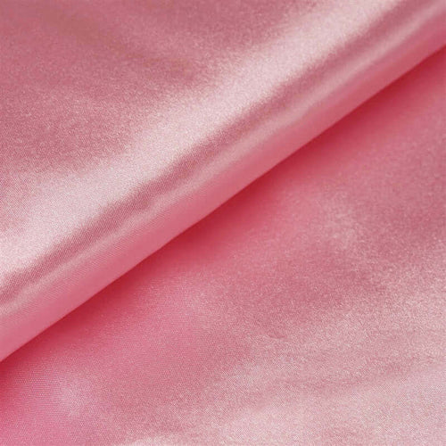 Pink satin fabric with a smooth, glossy texture. #whtbkgd