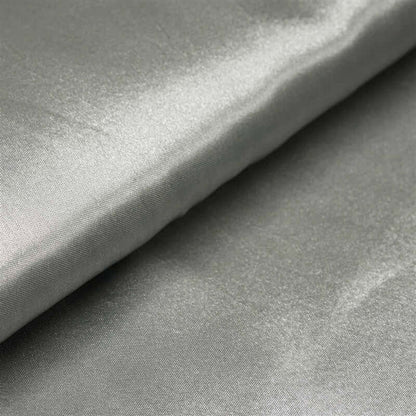 Silver satin fabric with a smooth, glossy finish. #whtbkgd
