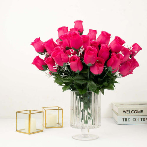 Bouquet of vibrant pink roses in a clear glass vase