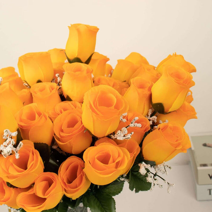 Bouquet of vibrant yellow roses with delicate white accents