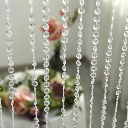 Crystal bead curtain with blurred floral background.