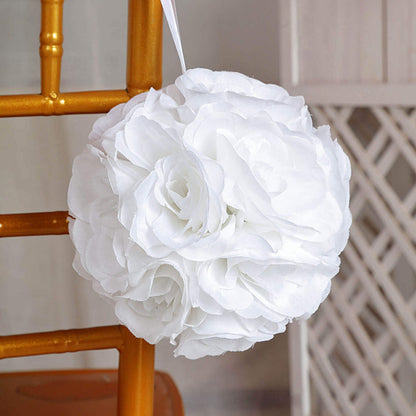 White floral pomander ball hanging from a chair.