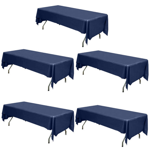 Set of five navy blue tablecloths on folding tables