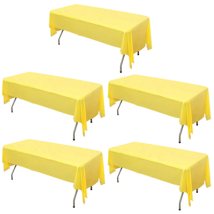 Set of five yellow folding tables with tablecloths on a white background.