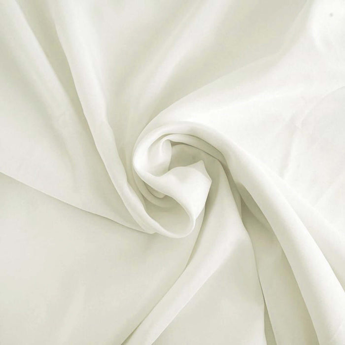 Soft white fabric draped elegantly, showcasing its smooth texture. #whtbkgd