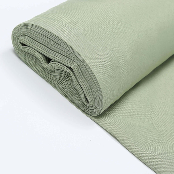 Rolled green fabric on a white background