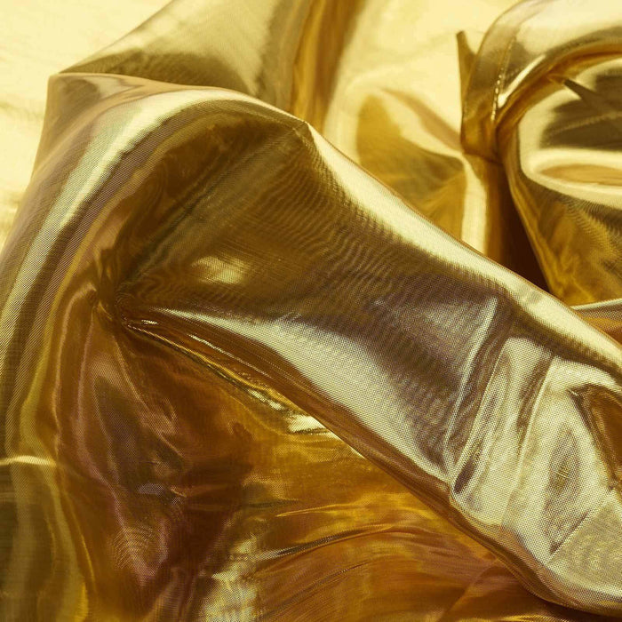 Shiny golden fabric with smooth texture and folds. #whtbkgd