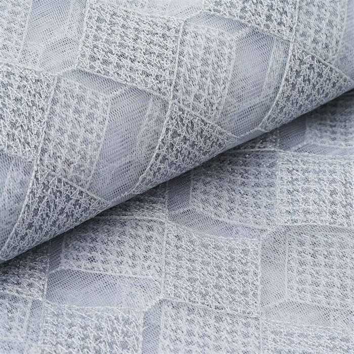 Gray textured fabric with geometric pattern detail.