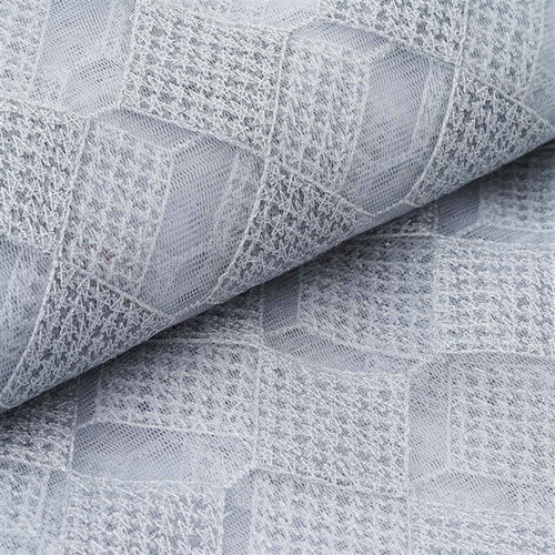 Gray textured fabric with geometric pattern detail.