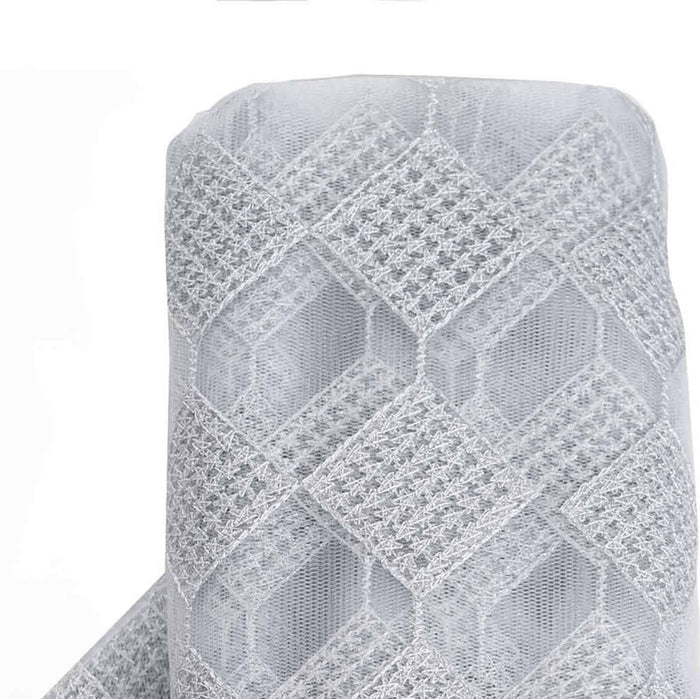 Gray lace fabric roll with geometric pattern on white backdrop