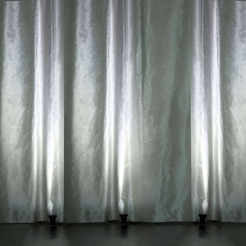 Elegant sheer curtains with soft light, creating a serene ambiance.