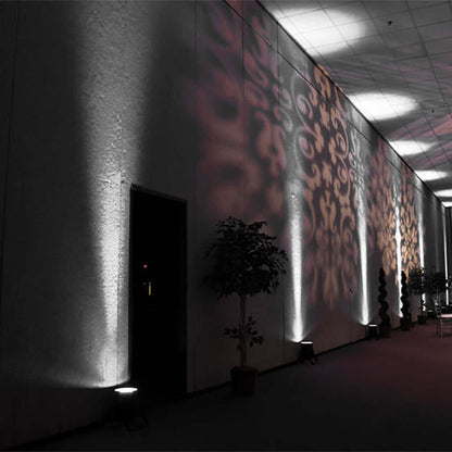 Decorative wall lighting with shadows in an indoor venue setting.