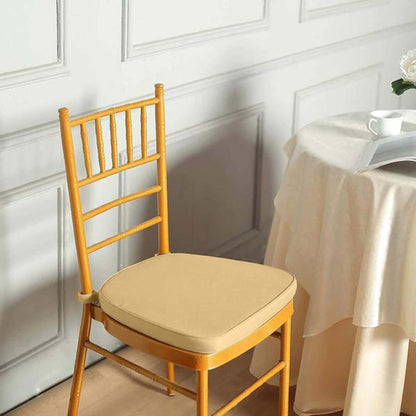 Yellow wooden chair with soft cushion in a cozy room setting.