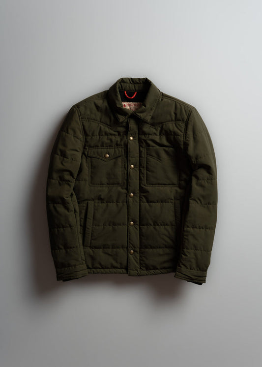 Olive green quilted jacket with button closure and two chest pockets, displayed against a plain background.