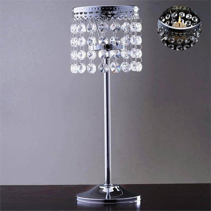 Elegant crystal table lamp with a sleek chrome base and hanging beads