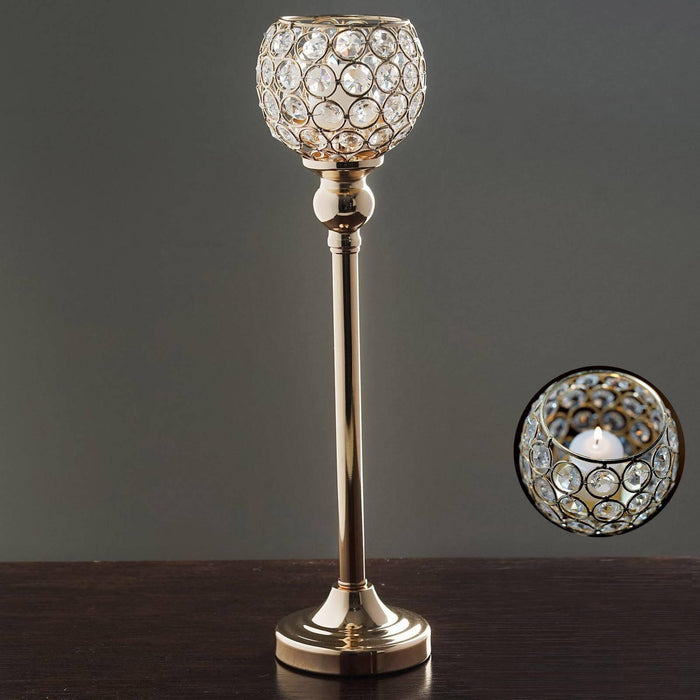 Elegant crystal candle holder with gold base and intricate design.
