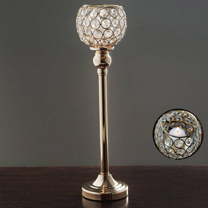 Elegant crystal candle holder with gold base and intricate design.