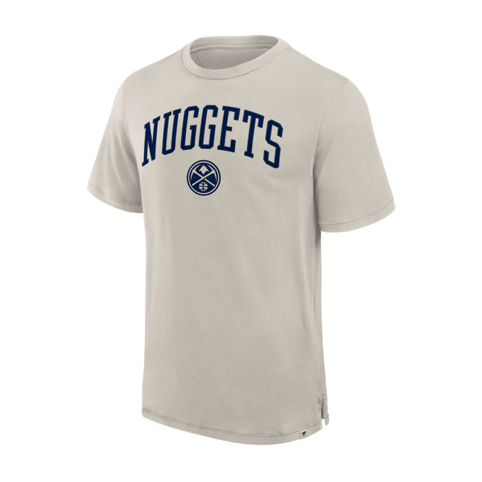 Front view ,light tan short-sleeve t-shirt featuring a navy blue graphic across the chest. The word 'NUGGETS' is printed in a bold, arched collegiate block font above a small, centered circular Denver Nuggets team logo