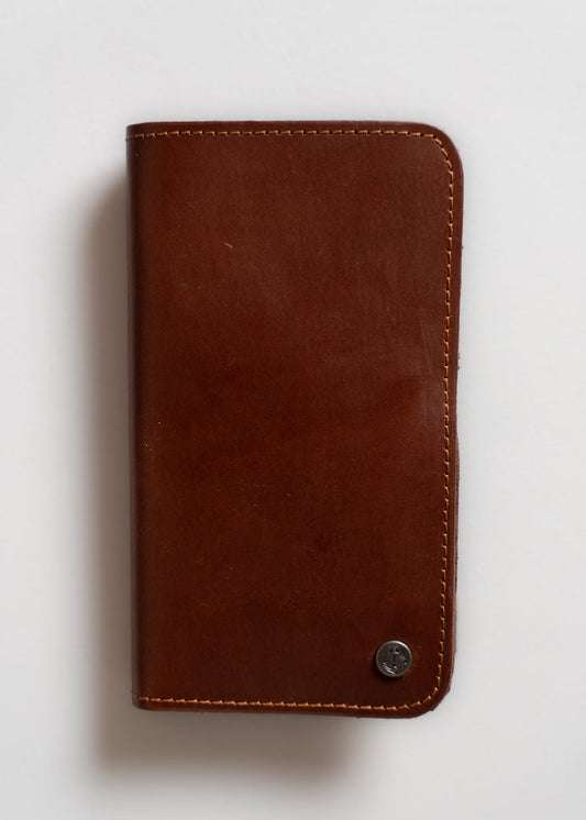 Brown leather wallet with visible stitching and a small metal button on the bottom right corner, set against a white background.