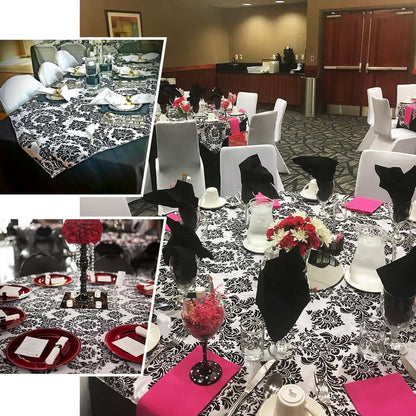 Elegant black and white table settings for an event.