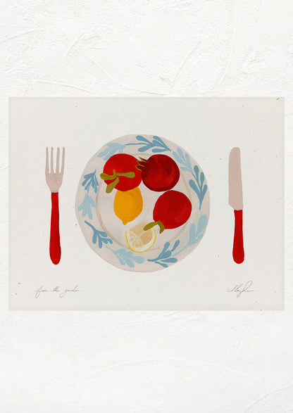 An art print of tomatoes and lemons on a plate with red knife and fork.