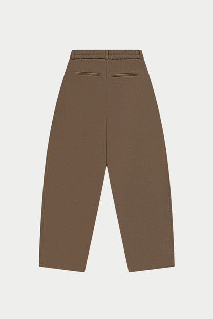 Brown barrel leg pants on a white background