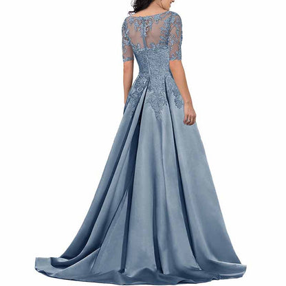 Elegant mother of the bride satin dress in blue with intricate lace details and a flowing skirt.