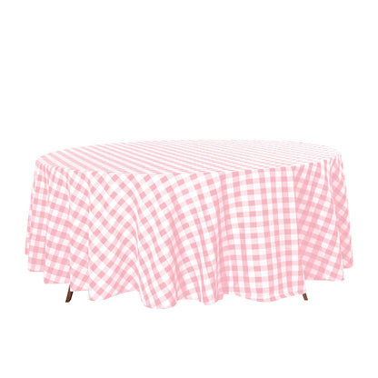Pink gingham round tablecloth on a white background