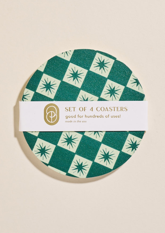 A set of paper coasters in green checkered star print.