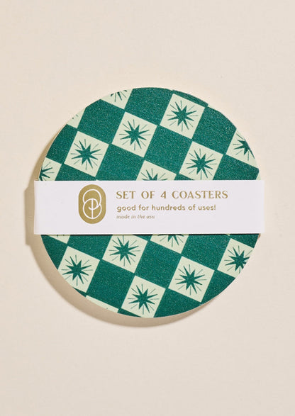 A set of paper coasters in green checkered star print.