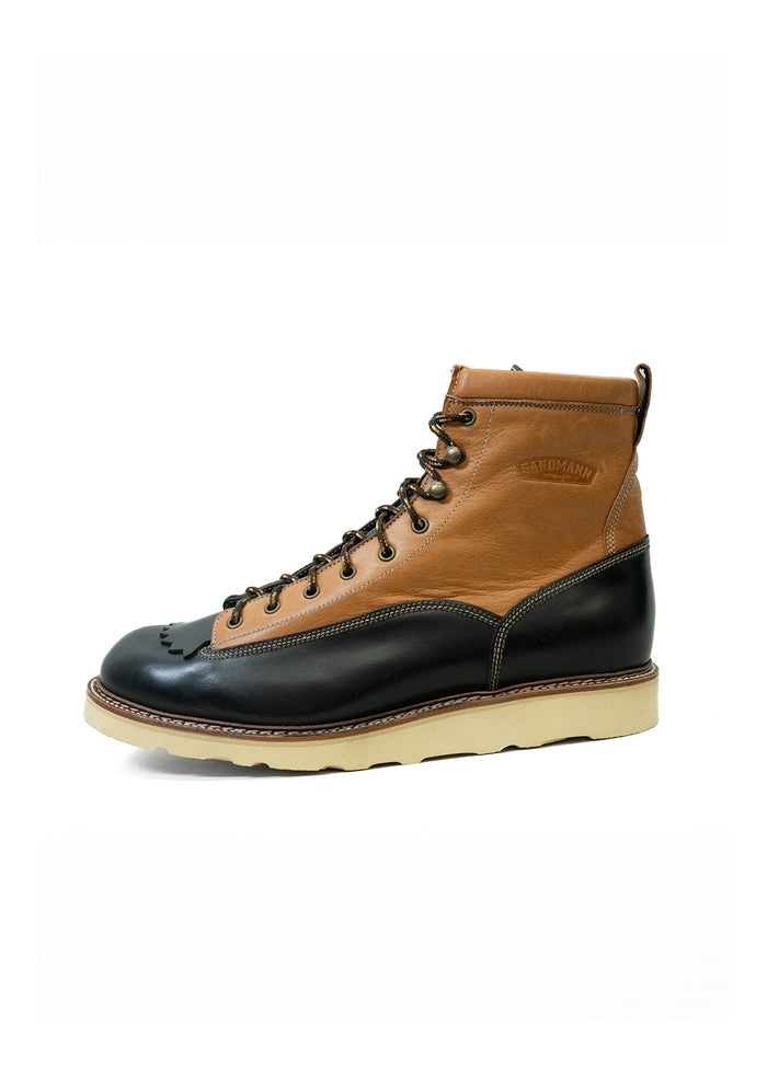 Brown and black leather boot with a beige sole, featuring detailed stitching and laces, displayed against a white background.