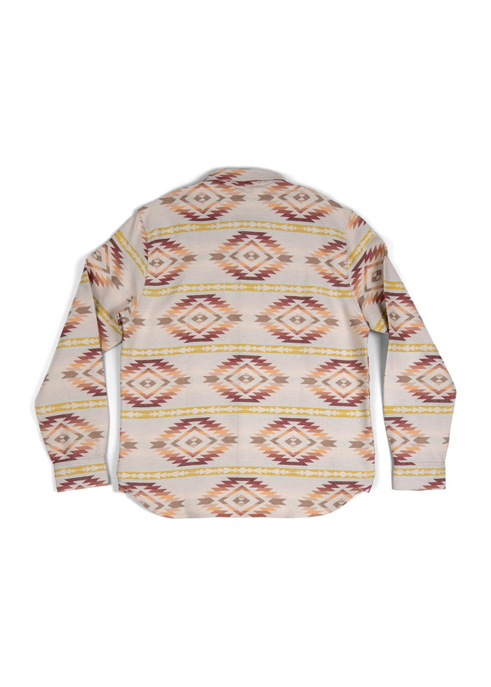 Back view of a long-sleeve shirt with a geometric pattern in earthy tones, featuring diamond shapes and horizontal stripes.