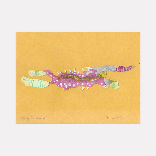 The artwork 'Spiky Swimmer' by Linda Lee Nicholas features a whimsical aquatic creature rendered in ink cutout technique. The abstract fish-like form combines mint green, purple, and silver tones with delicate white spikes along its body, set against a warm golden yellow background. The playful composition measures 8x11 inches and showcases a unique blend of organic shapes and textural elements.