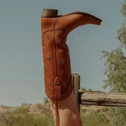 Star embroidered cowboy boots in rich brown leather with detailed stitching and a stylish design