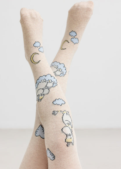 Cream-colored children's tights with Moomin figures, moon and clouds